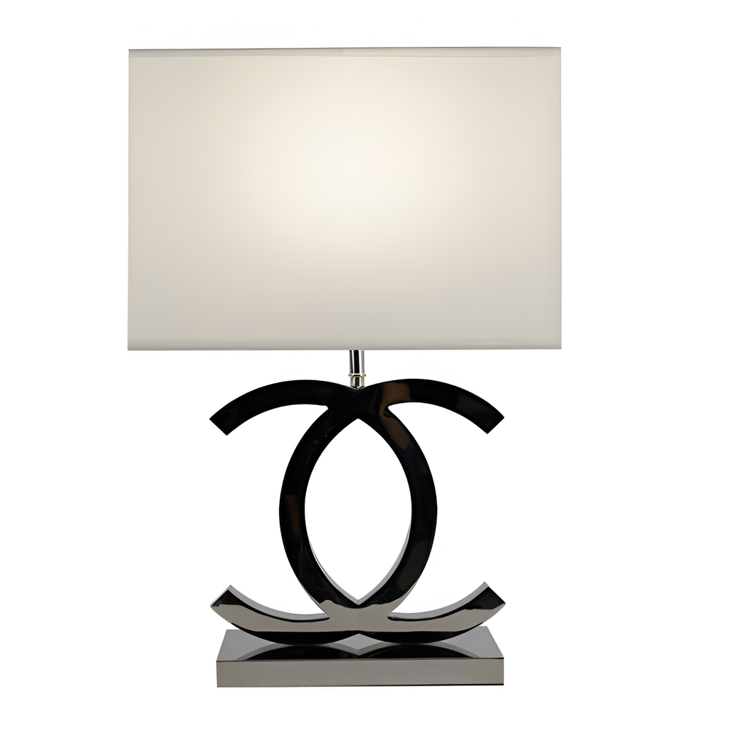 Poleret reflekterende bordlampe – skulpturel