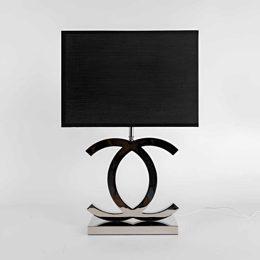 Poleret reflekterende bordlampe – skulpturel